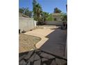 A concrete patio area in the backyard offers a great space for outdoor entertaining at 79 Magical Mystery Ln, Henderson, NV 89074