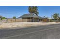 Single-story home with desert landscaping and cozy covered porch at 80 E Texas Ave, Henderson, NV 89015