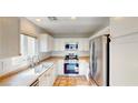 Modern kitchen featuring stainless steel appliances, gas range, and white cabinetry at 9116 Tailor Made Ave, Las Vegas, NV 89149