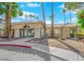Exterior view of a clubhouse featuring a desert landscape, with ample parking, and a convenient entryway at 1533 Linnbaker Ln # 102, Las Vegas, NV 89110