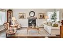 Cozy living room featuring a fireplace, plush seating, and stylish decor at 2036 Deer Springs Dr, Henderson, NV 89074