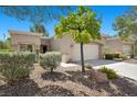Charming single-story home with a two-car garage and low maintenance desert landscaping at 2216 Spring Water Dr, Las Vegas, NV 89134