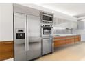 Contemporary kitchen with stainless steel appliances, including a refrigerator, microwave, oven, and dishwasher at 3722 S Las Vegas Blvd # 503, Las Vegas, NV 89158