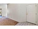 Inviting entryway features a white front door, tile flooring, and neutral walls at 3827 Desert Marina Dr # 211, Laughlin, NV 89029