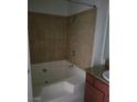 Clean bathroom featuring tiled shower/tub combination and granite countertops for a modern touch at 4050 Pacific Harbors Dr # 149, Las Vegas, NV 89121