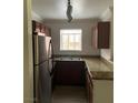 Efficient kitchen featuring stainless steel appliances, granite countertops, and ample cabinet space at 4050 Pacific Harbors Dr # 149, Las Vegas, NV 89121