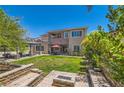 An entertainers backyard featuring a pergola, seating area and built in fire pit at 5879 Sky Heights Ct, Las Vegas, NV 89135