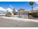 Street view of a home with desert landscaping and a gated entrance at 6101 Browning Way, Las Vegas, NV 89130