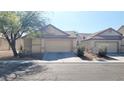 Charming single-story home with a well-maintained lawn and desert landscaping, alongside an attached two-car garage at 6516 Velvet Silk St, North Las Vegas, NV 89084