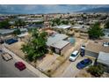Aerial view of a single story home in a residential neighborhood on a sunny day at 704 Kings Ave, North Las Vegas, NV 89030