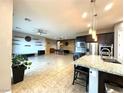 Spacious open-concept living space with a modern kitchen, and ample space for entertaining at 10719 Hammett Park Ave, Las Vegas, NV 89166