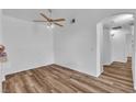 Spacious bedroom with a ceiling fan and wood-look flooring at 1300 S Arlington St # 120, Las Vegas, NV 89104