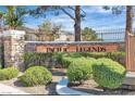 Entrance to the Pacific Legends community with stone wall and wrought iron fence at 1300 S Arlington St # 120, Las Vegas, NV 89104