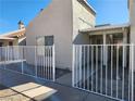 This home features a private front entrance enclosed with a charming white picket fence at 2106 Pebble Creek Ln, Laughlin, NV 89029