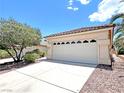 Charming home featuring a two-car garage with decorative windows and a well-maintained driveway at 2119 Sunset Vista Ave, Henderson, NV 89052