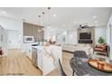 Modern kitchen with stainless steel appliances and a large marble island at 2353 Lauren Dr, Las Vegas, NV 89134