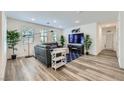 Cozy living room with wood floors, neutral decor, and an abundance of natural light at 2555 Hampton Rd # 2108, Henderson, NV 89052