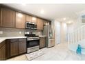This kitchen features stainless steel appliances and ample cabinet space at 285 Rain Quail Way, Henderson, NV 89012