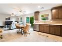 This living room features dining area, tile floors and sliding door access to the backyard at 285 Rain Quail Way, Henderson, NV 89012