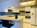 Bright kitchen featuring modern appliances and ample counter space for cooking at 3766 Colonial Dr, Las Vegas, NV 89121