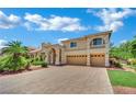 Attractive two-story home with a three-car garage, paver driveway, and well-maintained lawn at 4139 Abernethy Forest Pl, Las Vegas, NV 89141