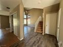Spacious living room featuring wood flooring and a staircase at 5128 Sandstone Dr, Las Vegas, NV 89142