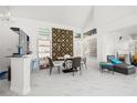 Stylish dining room featuring marble floors, a modern table, and contemporary decor at 5332 Desert Blossom Rd, Las Vegas, NV 89107