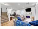 Bright living room featuring a modern fireplace, hardwood floors, and comfortable seating at 6170 E Sahara Ave # 1061, Las Vegas, NV 89142