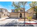 Charming two-story home with a two-car garage and well-manicured landscaping at 632 Monument Point St, Henderson, NV 89002