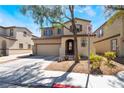 Charming two-story home with a two-car garage and well-manicured landscaping at 632 Monument Point St, Henderson, NV 89002