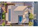 Aerial view of backyard showcasing a private pool, desert landscaping, and a tiled roof at 7331 Abundant Harvest Ave, Las Vegas, NV 89131
