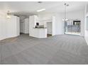 Bright living room featuring an open floor plan and sliding glass door at 7524 Fencerow St, Las Vegas, NV 89131