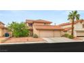 Charming two-story home featuring a three-car garage and a well-maintained, landscaped front yard at 7544 Shangri La Ave, Las Vegas, NV 89147