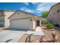 Charming single-story home with a two-car garage and low-maintenance desert landscaping at 8320 Highland Ranch St, Las Vegas, NV 89131