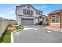 Attractive two-story home with a large driveway, attached garage, and well-manicured landscaping at 8389 Charlton Valley Ct, Las Vegas, NV 89123