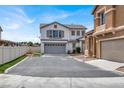 Beautiful two-story home with a spacious driveway and attached two-car garage, showcasing curb appeal at 8389 Charlton Valley Ct, Las Vegas, NV 89123