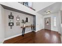 Inviting entryway with hardwood floors and decorative console table at 8780 Autumn Wreath Ave, Las Vegas, NV 89129
