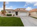 Charming two-story home with manicured lawn and desert landscaping at 8780 Autumn Wreath Ave, Las Vegas, NV 89129