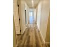 Hallway with hard surface flooring and doors leading to various rooms at , Las Vegas, NV 89121