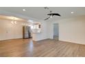 Bright living room featuring laminate flooring, recessed lighting, and neutral color palette at 1123 Chapman Dr, Las Vegas, NV 89104