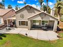 A lovely backyard with a large concrete patio, perfect for outdoor dining and entertaining at 1131 Golf Club, Laughlin, NV 89029