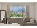 Bedroom featuring a mountain view, dresser, decor, and sitting chair at 12426 Alpenglow Ct, Las Vegas, NV 89138