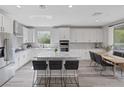 Bright open kitchen with granite counters, stainless steel appliances, and an island with seating at 12426 Alpenglow Ct, Las Vegas, NV 89138