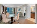Inviting living area with dining table, sofa, and access to a bedroom, and a balcony with city views at 135 E Harmon Ave # 1621, Las Vegas, NV 89109