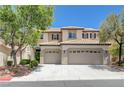 Well-maintained two-story home with a three-car garage and tile roof at 1624 Ravanusa Dr, Henderson, NV 89052