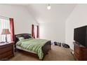 Cozy bedroom with carpeted floors, natural light, and ample space for relaxation and personalization at 165 Spinnaker Dr, Henderson, NV 89015