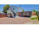 Contemporary exterior with a corrugated metal facade and brightly colored orange doors at 1708 Cedar Ave, Las Vegas, NV 89101