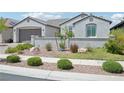 Charming single-story home featuring a well-kept desert-style front yard with lush green shrubs at 172 Lunga Ave, Henderson, NV 89011
