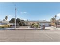 Inviting single-story home featuring gated entry, desert landscaping and solar panels at 1912 Parkchester Dr, Las Vegas, NV 89108