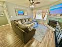 Bright living room with a fireplace, ceiling fan, and comfortable sectional sofa at 2016 Mesquite Ln # 302, Laughlin, NV 89029